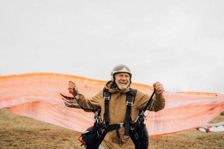 Man about to check paragliding off his retirement bucket list|