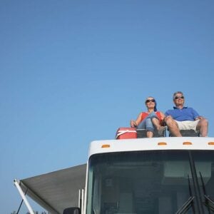 A couple on the roof of their RV